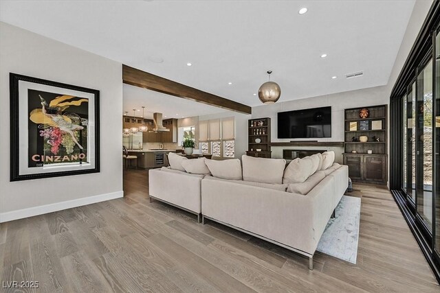 11906 Port Labelle Dr, Las Vegas, NV 89141 - living area featuring wood finished floors, recessed lighting, and beam ceiling