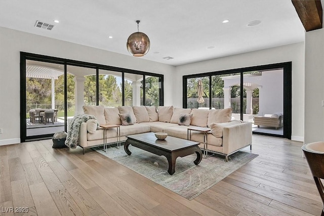 11906 Port Labelle Dr, Las Vegas, NV 89141 - living room with light wood-type flooring and recessed lighting