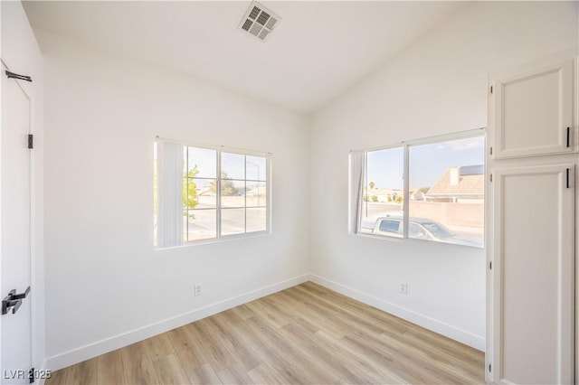 2403 Sexton Ave, North Las Vegas, NV 89031 - unfurnished bedroom featuring lofted ceiling and light wood finished floors