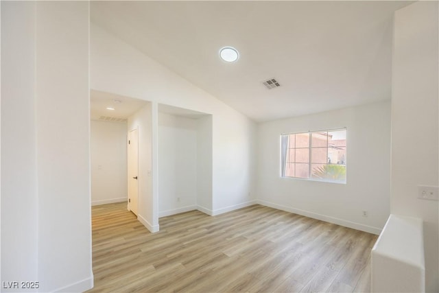 2403 Sexton Ave, North Las Vegas, NV 89031 - unfurnished room featuring light wood-type flooring, vaulted ceiling, and recessed lighting