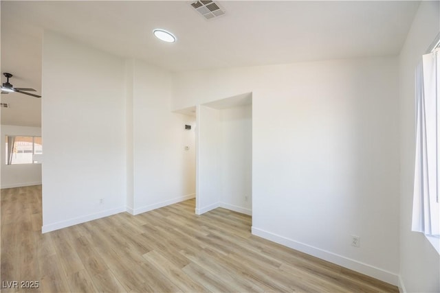 2403 Sexton Ave, North Las Vegas, NV 89031 - unfurnished room with light wood-style floors, ceiling fan, and lofted ceiling