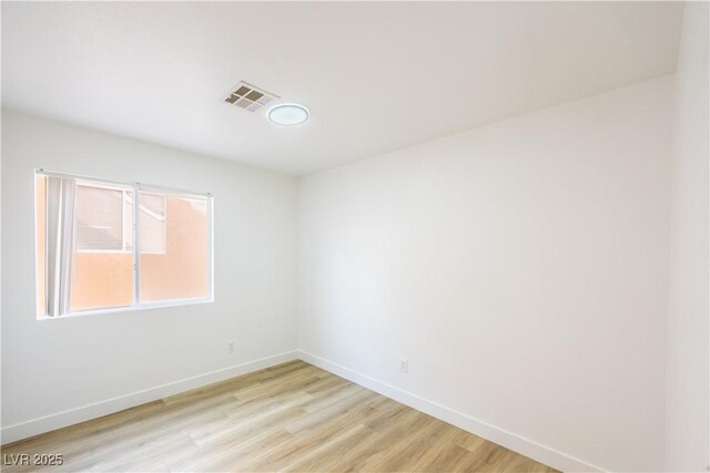 2403 Sexton Ave, North Las Vegas, NV 89031 - spare room with light wood-style flooring and baseboards