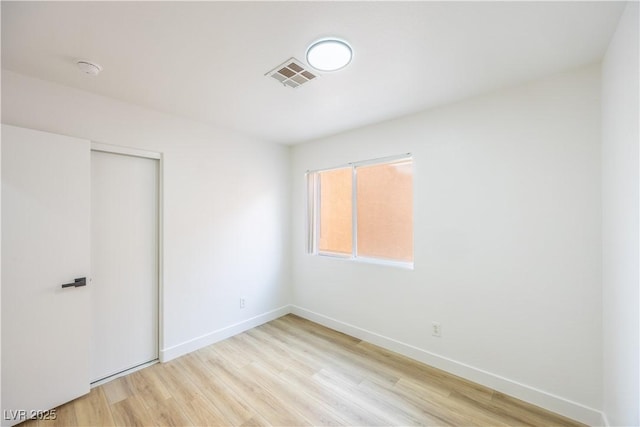 2403 Sexton Ave, North Las Vegas, NV 89031 - unfurnished bedroom featuring light wood finished floors and a closet