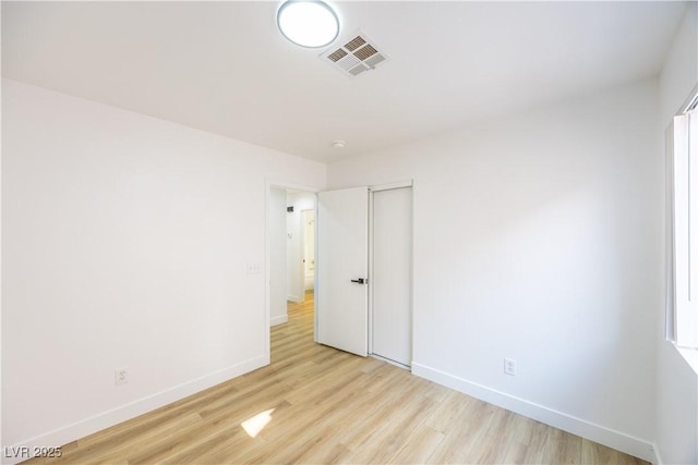 2403 Sexton Ave, North Las Vegas, NV 89031 - unfurnished bedroom with light wood-style floors and a closet