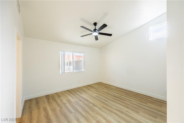 2403 Sexton Ave, North Las Vegas, NV 89031 - spare room with light wood-style flooring, ceiling fan, and vaulted ceiling