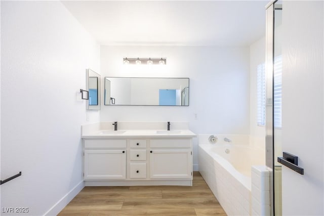2403 Sexton Ave, North Las Vegas, NV 89031 - full bathroom with a bath, double vanity, and wood finished floors