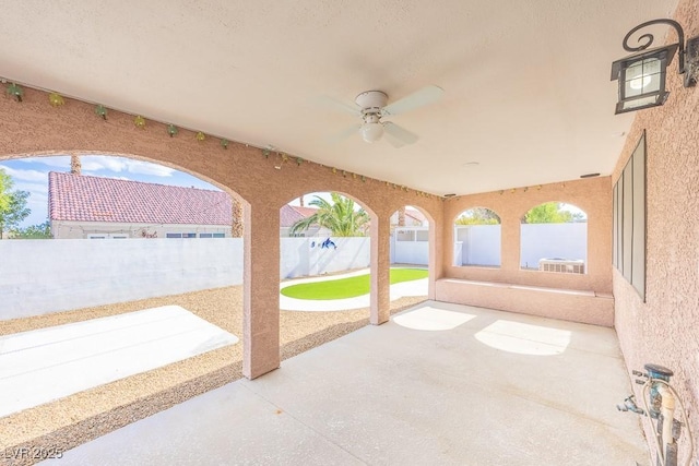 2403 Sexton Ave, North Las Vegas, NV 89031 - fenced backyard with ceiling fan and a patio