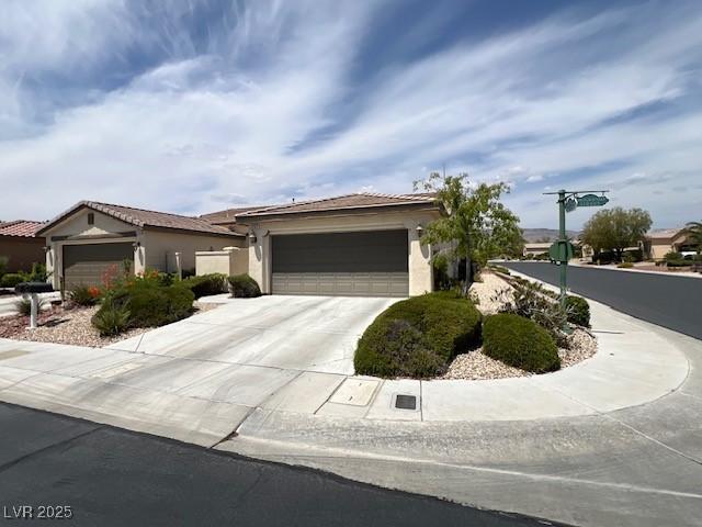 5147 Progresso St, Las Vegas, NV 89135 - ranch-style house with a garage, driveway, and stucco siding