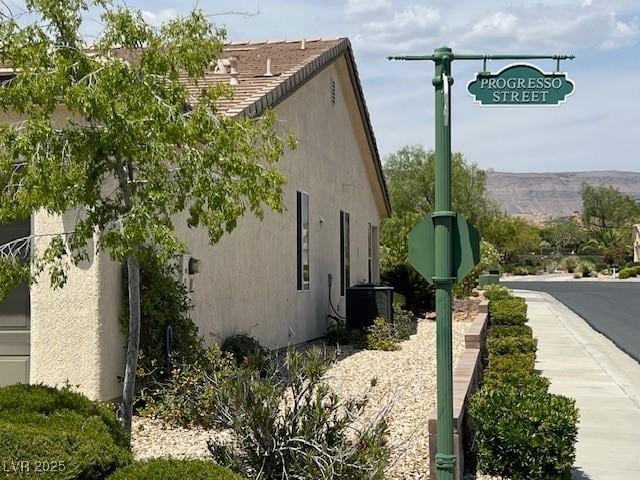 5147 Progresso St, Las Vegas, NV 89135 - view of side of home featuring stucco siding