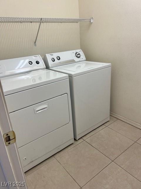 5147 Progresso St, Las Vegas, NV 89135 - laundry room with independent washer and dryer and light tile patterned floors