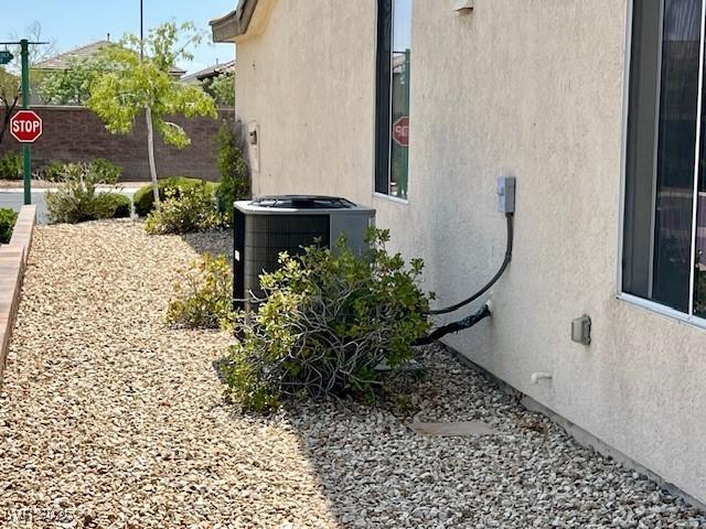 5147 Progresso St, Las Vegas, NV 89135 - view of side of home featuring stucco siding