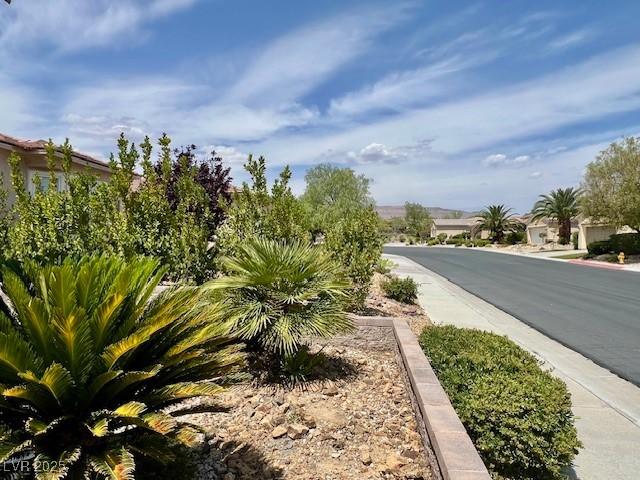 5147 Progresso St, Las Vegas, NV 89135 - view of asphalt street with sidewalks and curbs