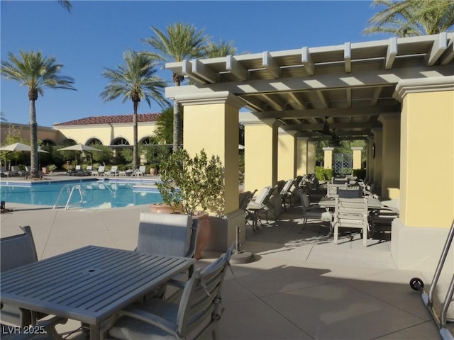 5147 Progresso St, Las Vegas, NV 89135 - community pool with ceiling fan, a patio area, and outdoor dining space