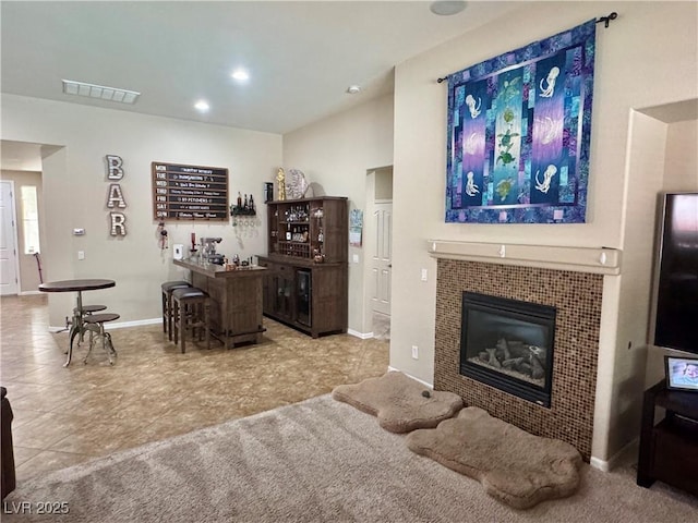 6614 Collingsworth St, Las Vegas, NV 89131 - living area featuring a bar, a tiled fireplace, and recessed lighting