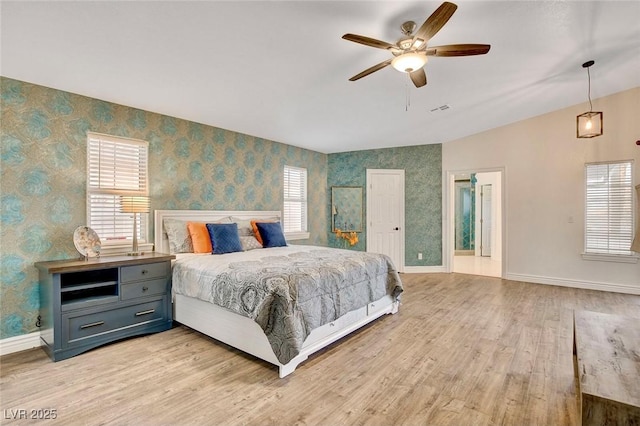 1970 Del Font Ct, Las Vegas, NV 89117 - bedroom with wallpapered walls, light wood finished floors, lofted ceiling, and ceiling fan