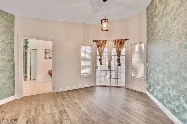 1970 Del Font Ct, Las Vegas, NV 89117 - empty room featuring wood finished floors and wallpapered walls