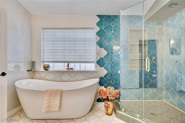 1970 Del Font Ct, Las Vegas, NV 89117 - bathroom with a freestanding tub, a shower stall, and tile walls