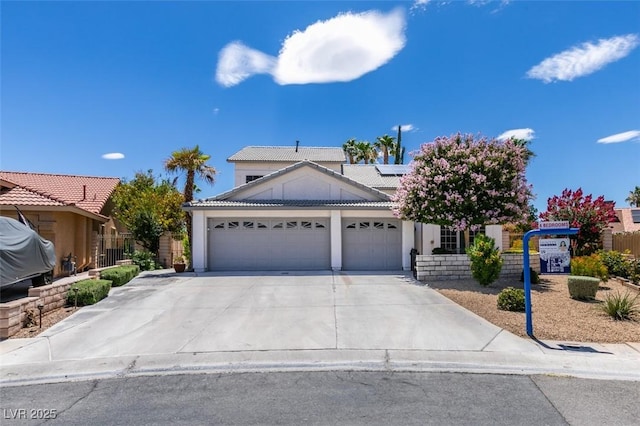 5505 Excelsior Springs Ln, Las Vegas, NV 89130 - view of front of house featuring a garage, roof mounted solar panels, concrete driveway, stucco siding, and a tiled roof