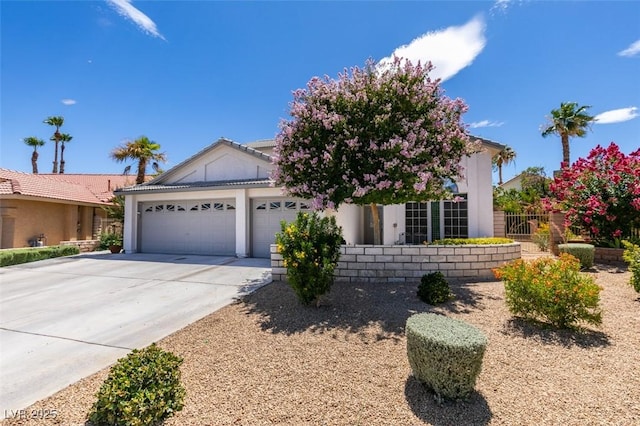 5505 Excelsior Springs Ln, Las Vegas, NV 89130 - view of front of house featuring an attached garage, driveway, and stucco siding
