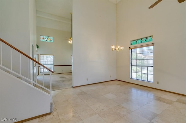 5505 Excelsior Springs Ln, Las Vegas, NV 89130 - unfurnished room featuring a high ceiling, a ceiling fan, plenty of natural light, and stairs