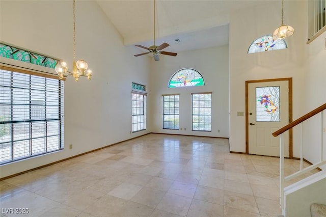 5505 Excelsior Springs Ln, Las Vegas, NV 89130 - entrance foyer featuring high vaulted ceiling, ceiling fan, a chandelier, and stairs