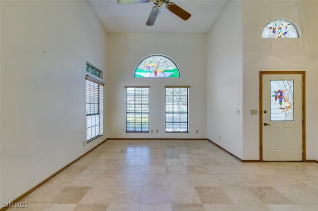 5505 Excelsior Springs Ln, Las Vegas, NV 89130 - entrance foyer with a high ceiling, a ceiling fan, and light tile patterned flooring