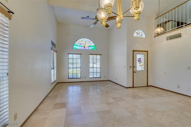 5505 Excelsior Springs Ln, Las Vegas, NV 89130 - foyer entrance featuring a towering ceiling, a ceiling fan, a chandelier, and light tile patterned floors