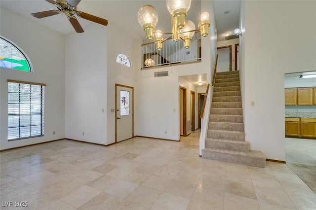 5505 Excelsior Springs Ln, Las Vegas, NV 89130 - foyer entrance with a towering ceiling, stairway, ceiling fan, a chandelier, and light tile patterned flooring