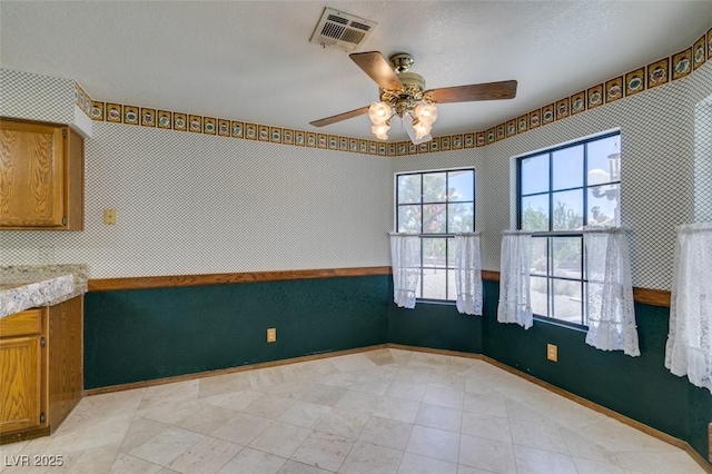 5505 Excelsior Springs Ln, Las Vegas, NV 89130 - unfurnished dining area with a ceiling fan and baseboards