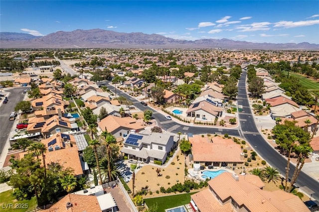 5505 Excelsior Springs Ln, Las Vegas, NV 89130 - aerial perspective of suburban area featuring a mountain backdrop and a pool