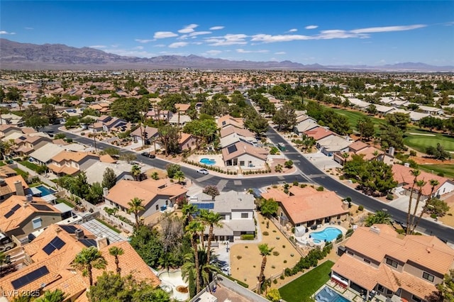 5505 Excelsior Springs Ln, Las Vegas, NV 89130 - aerial perspective of suburban area featuring a mountain backdrop and a pool area