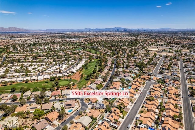 5505 Excelsior Springs Ln, Las Vegas, NV 89130 - aerial view of property's location featuring a mountainous background and nearby suburban area