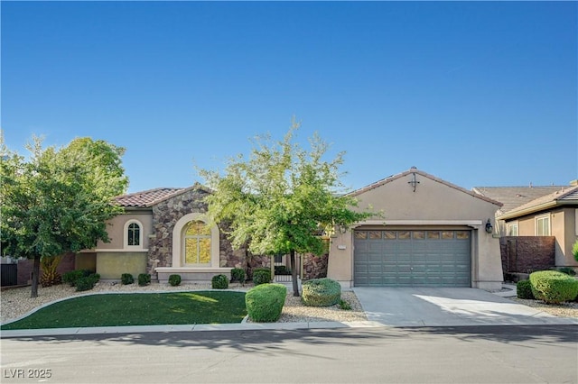 2172 De Rouge Ave, Henderson, NV 89044 - mediterranean / spanish-style home featuring stucco siding, an attached garage, a tiled roof, concrete driveway, and a front yard