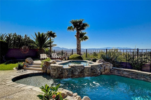 2172 De Rouge Ave, Henderson, NV 89044 - view of pool with a fenced backyard, a mountain view, and a pool with connected hot tub