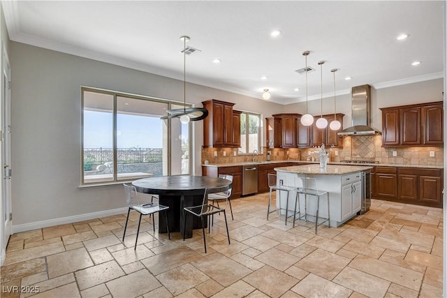 2172 De Rouge Ave, Henderson, NV 89044 - kitchen featuring wall chimney exhaust hood, appliances with stainless steel finishes, decorative backsplash, a center island, and recessed lighting