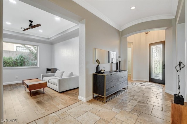 2172 De Rouge Ave, Henderson, NV 89044 - entryway with crown molding, a ceiling fan, stone tile flooring, recessed lighting, and arched walkways