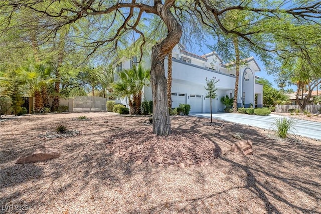 2209 Purple Majesty Ct, Las Vegas, NV 89117 - view of front of house featuring stucco siding, concrete driveway, and a garage