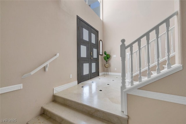 2209 Purple Majesty Ct, Las Vegas, NV 89117 - entrance foyer with stairs, french doors, a high ceiling, and tile patterned floors