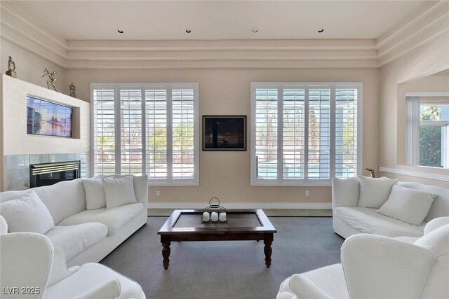 2209 Purple Majesty Ct, Las Vegas, NV 89117 - living area featuring a glass covered fireplace and baseboards