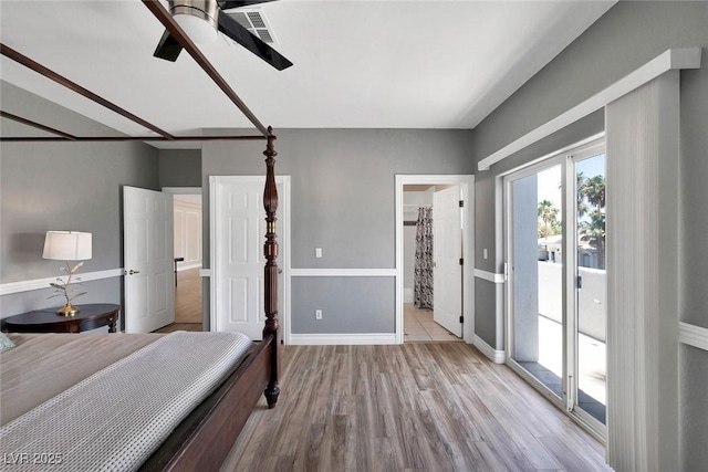 2209 Purple Majesty Ct, Las Vegas, NV 89117 - bedroom featuring access to exterior, wood finished floors, a ceiling fan, and ensuite bathroom