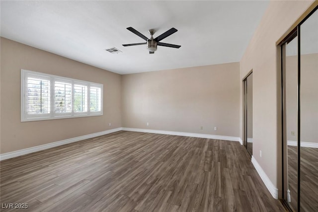 2209 Purple Majesty Ct, Las Vegas, NV 89117 - empty room with dark wood-style floors and a ceiling fan