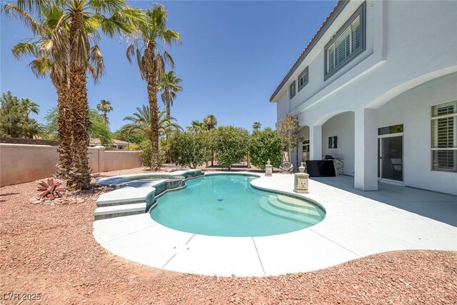 2209 Purple Majesty Ct, Las Vegas, NV 89117 - view of swimming pool with a patio, a fenced backyard, and a pool with connected hot tub