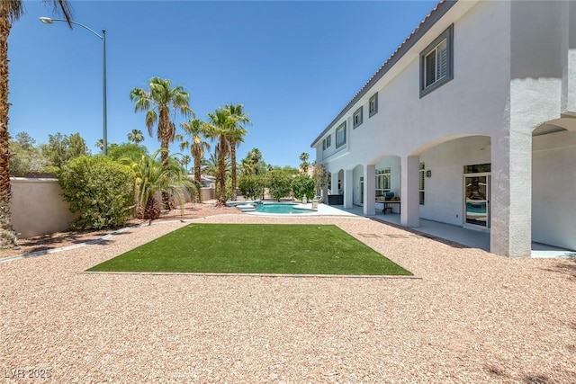 2209 Purple Majesty Ct, Las Vegas, NV 89117 - fenced backyard with a patio