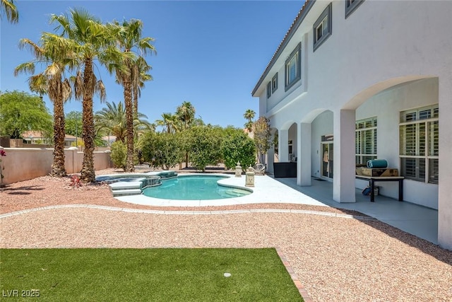 2209 Purple Majesty Ct, Las Vegas, NV 89117 - view of pool featuring a patio, a pool with connected hot tub, and a fenced backyard