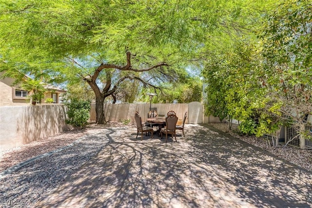 2209 Purple Majesty Ct, Las Vegas, NV 89117 - fenced backyard featuring a patio area and outdoor dining area