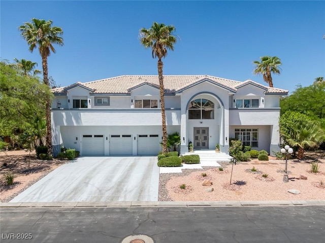 2209 Purple Majesty Ct, Las Vegas, NV 89117 - mediterranean / spanish home with french doors, stucco siding, concrete driveway, a garage, and a tiled roof