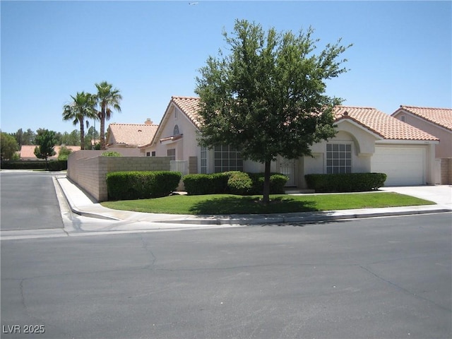 7955 Canto Ave, Las Vegas, NV 89147 - view of front of property featuring stucco siding, an attached garage, a tile roof, and concrete driveway