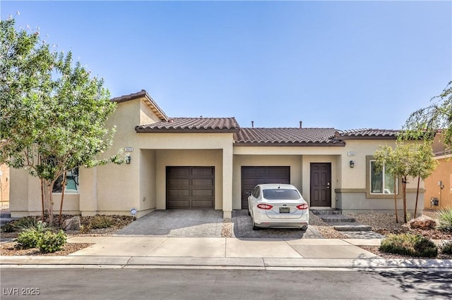 7472 Garnet Moon St, North Las Vegas, NV 89084 - view of front of home featuring a garage, driveway, stucco siding, and a tiled roof