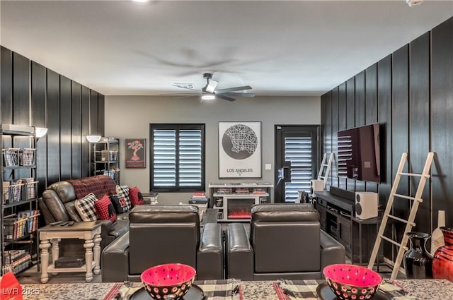 7472 Garnet Moon St, North Las Vegas, NV 89084 - home theater room with ceiling fan and wood finished floors