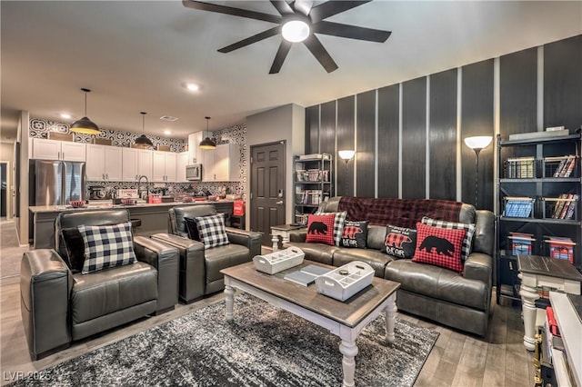 7472 Garnet Moon St, North Las Vegas, NV 89084 - living area featuring a ceiling fan and light wood finished floors
